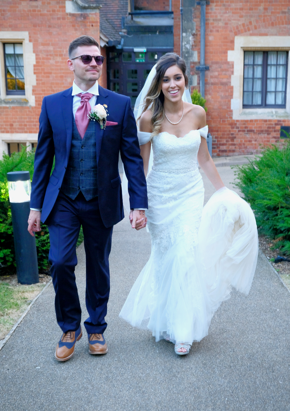 Bride and Groom smiling during summer wedding at the Wood Norton in Evesham