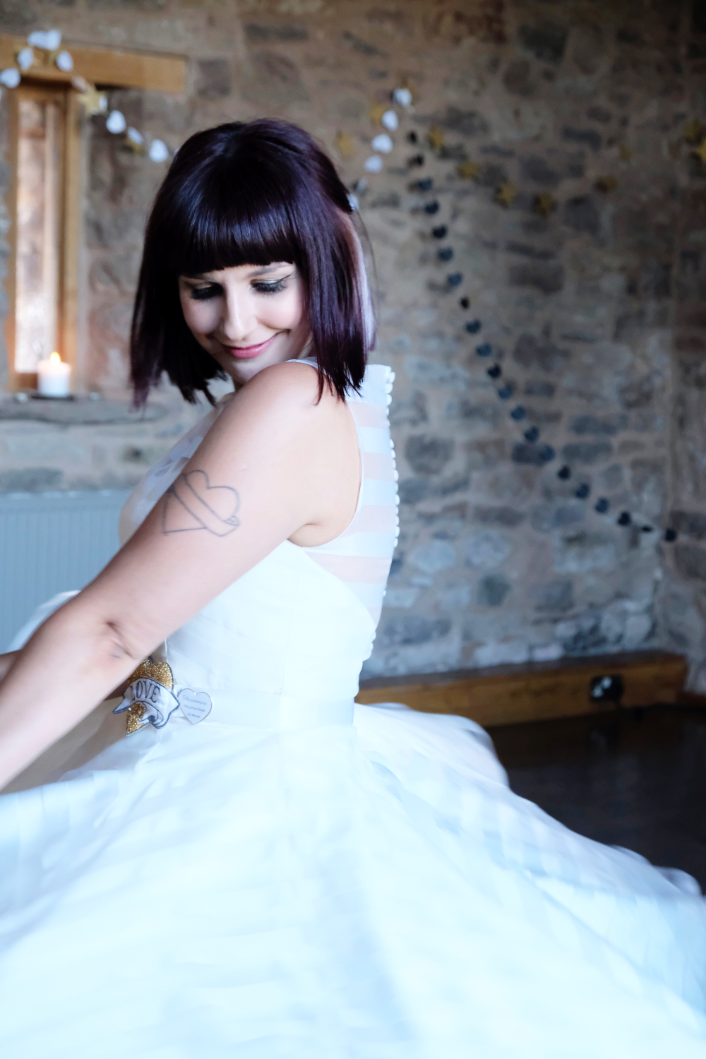Beautiful rock and roll bride smiling during first dance in Lyde Arundel in Hereford