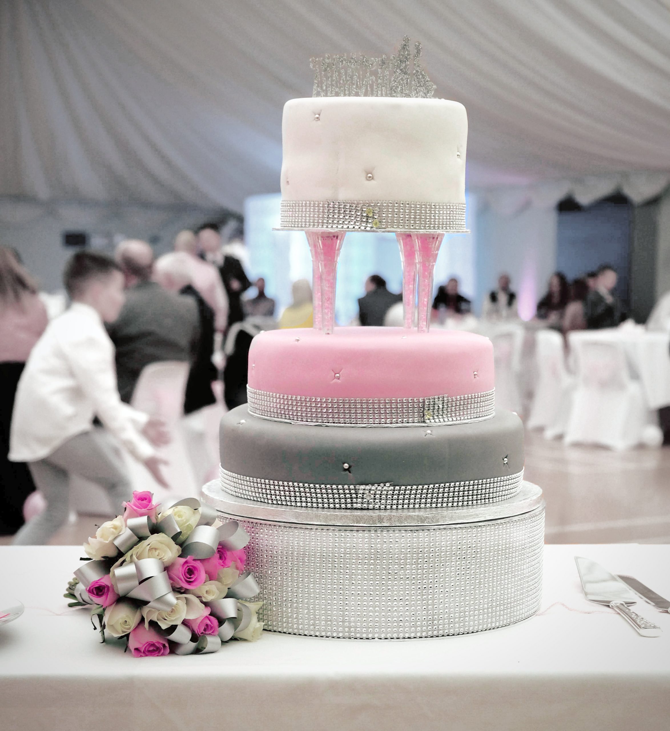 delicious pink white and grey wedding cake diamante