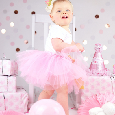 girl first birthday photoshoot pink