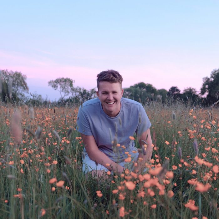 Laughing boy in a field of daisies redditch
